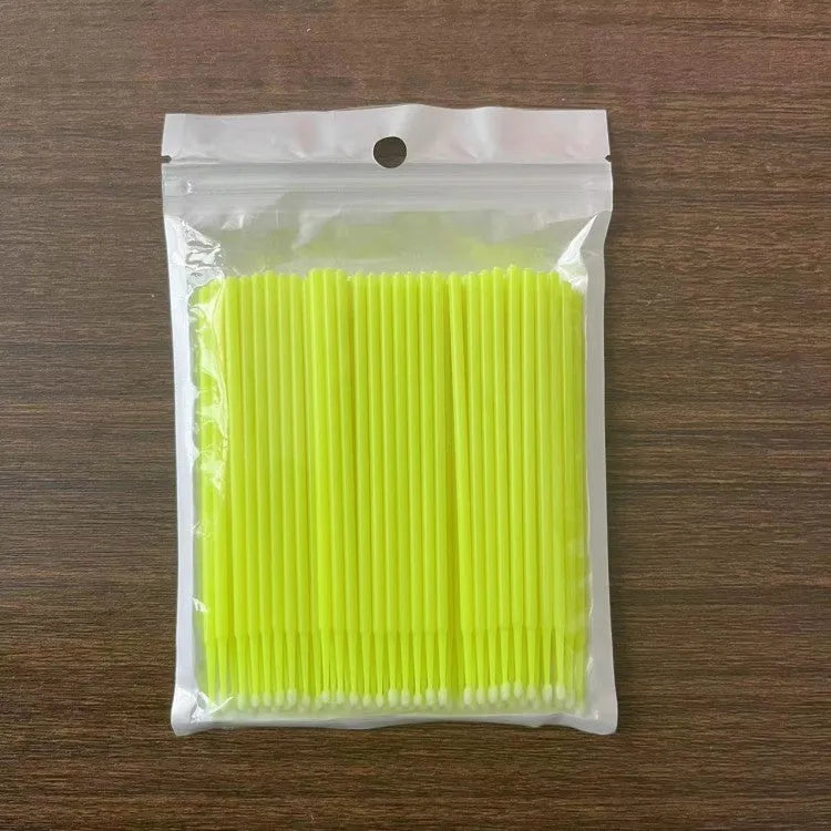 Disposable micro applicator brushes with coloured plastic handles and bendable cotton swab tips