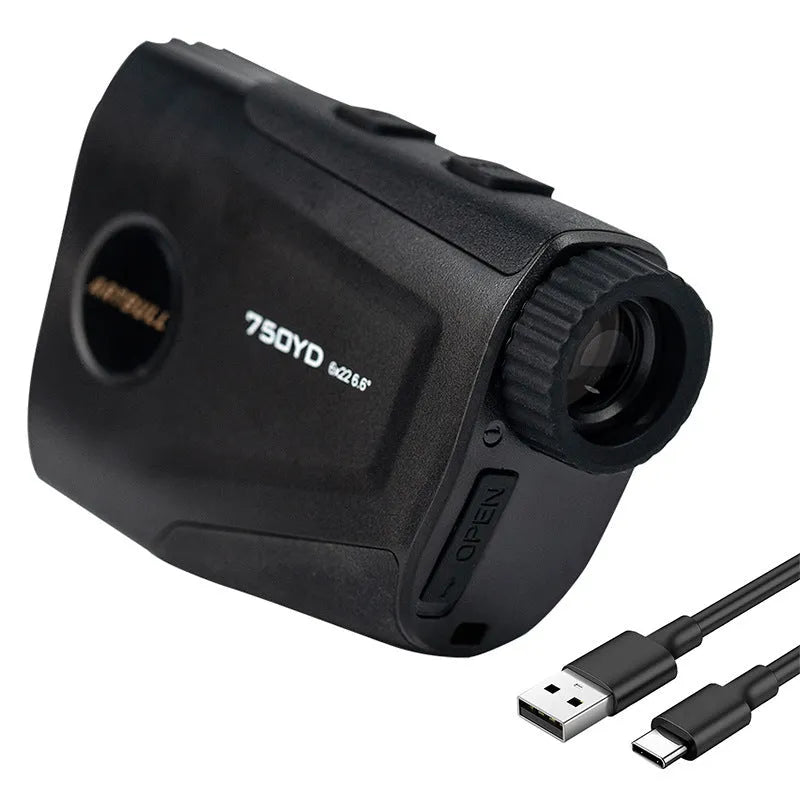 Black golf laser rangefinder with LCD display showing yardage, placed on a green golf towel.