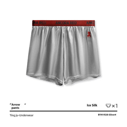 Men's solid colour boxer briefs in black, shown flat, highlighting the mid-waist design and knitted fabric texture.