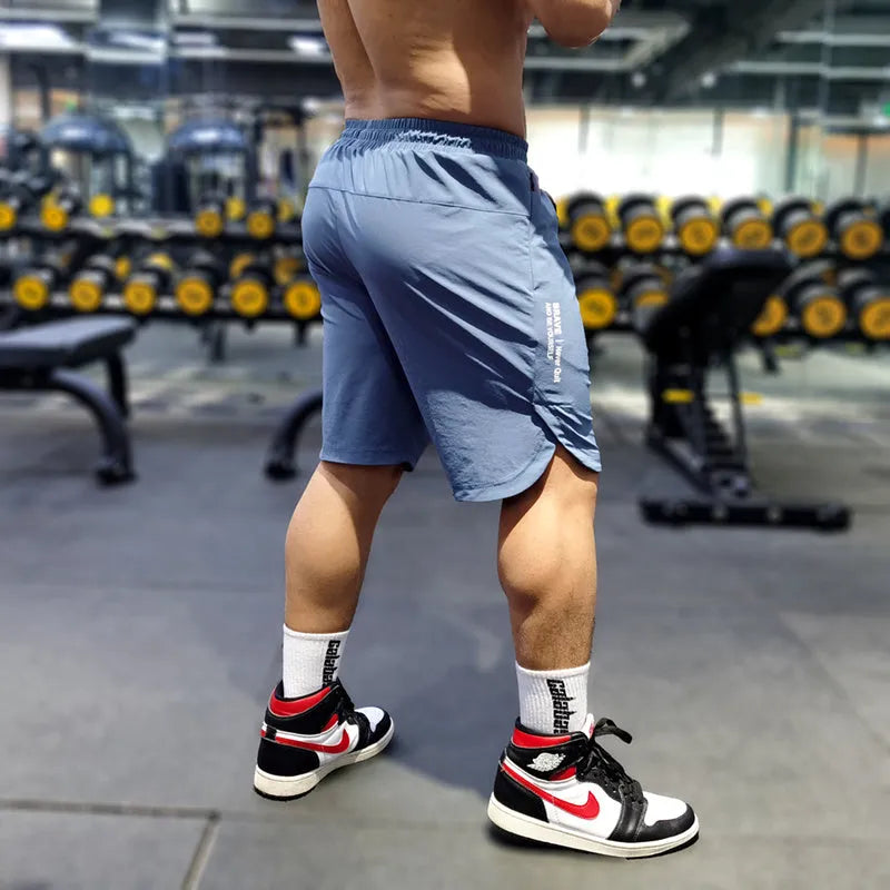 Men's quick-dry running shorts in polyamide-spandex blend fabric shown in black, blue and grey colour options