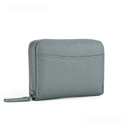 Genuine leather zipper coin purse in a solid colour showing sewing line detail.