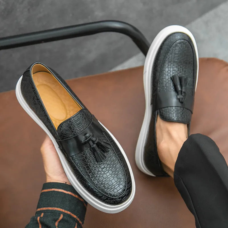 Men's black casual leather shoes with fringe detailing on round toe and low heel