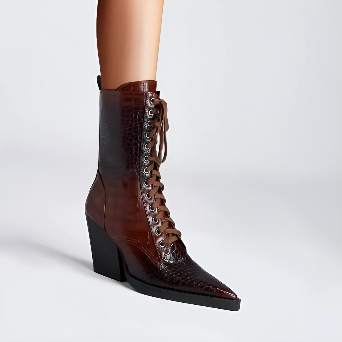 Dark brown women's lace-up ankle boots with a pointed toe and a chunky block heel.