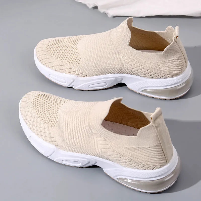 Slip-on breathable mesh sock shoes with a low-top design and PVC sole, shown in a neutral colour.