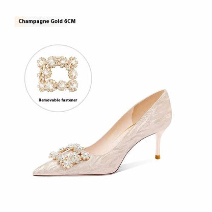 Champagne gold pointed-toe high heel pumps with stiletto heel and rhinestone decoration on the upper.