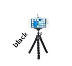 Mini flexible octopus tripod stand with sponge grip holding a smartphone.