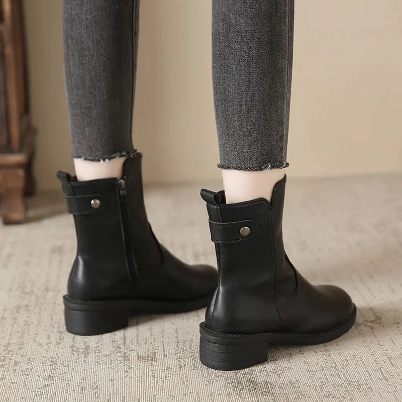 Black women's low heel boots with side zip and round toe design