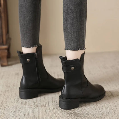Black women's low heel boots with side zip and round toe design