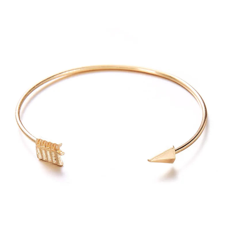 Gold-coloured vintage arrow knotted cuff bracelet for women.