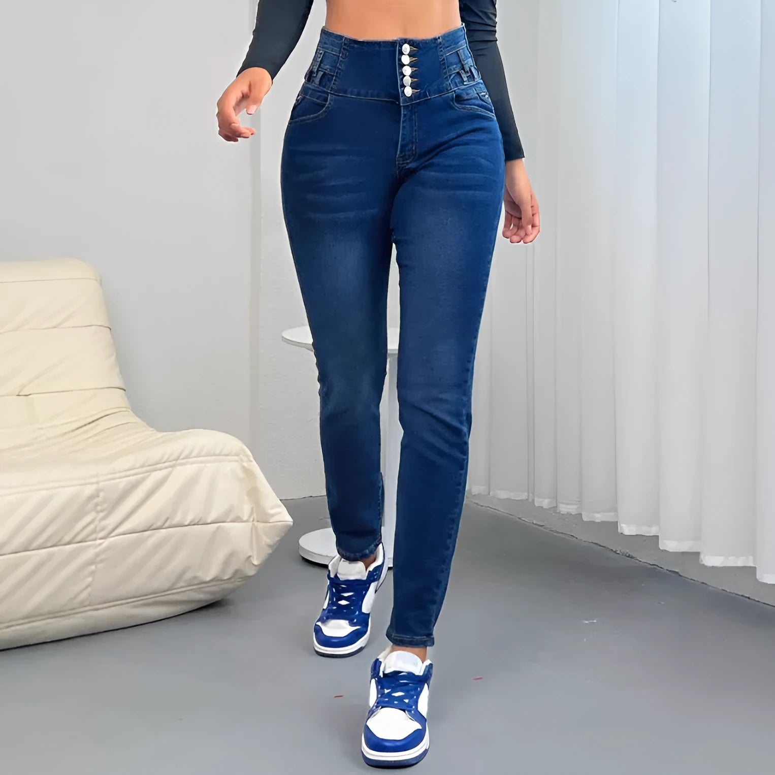 Dark blue women's cotton denim trousers with breasted waistband and straight-leg fit.
