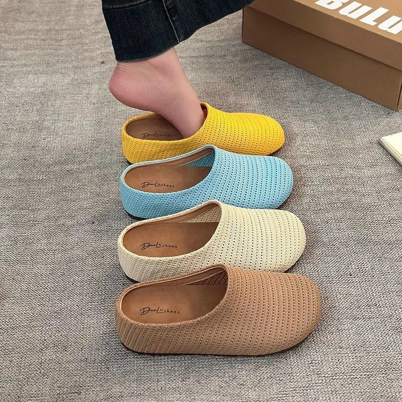 Baotou Boken women's cloth upper slippers with rubber sole in beige, shown in a leisure setting.