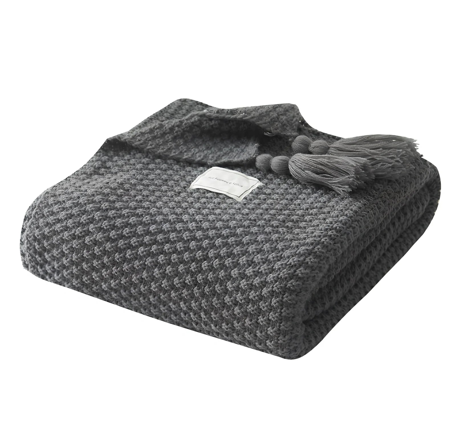 Fringed knitting blanket in beige colour showing 5cm fringe detailing and dense acrylic weave texture