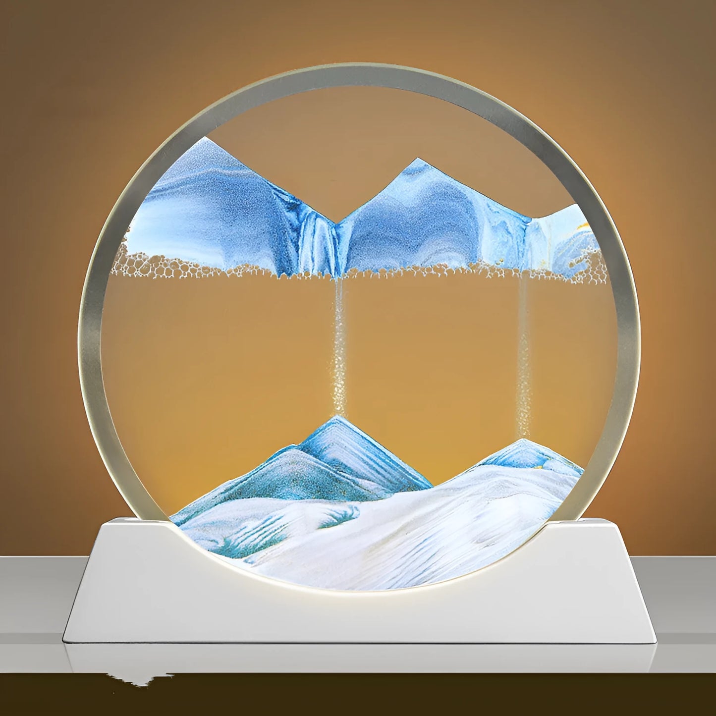 Modern abstract quicksand painting rotary night lamp in blue, 12 inches tall on a desktop.