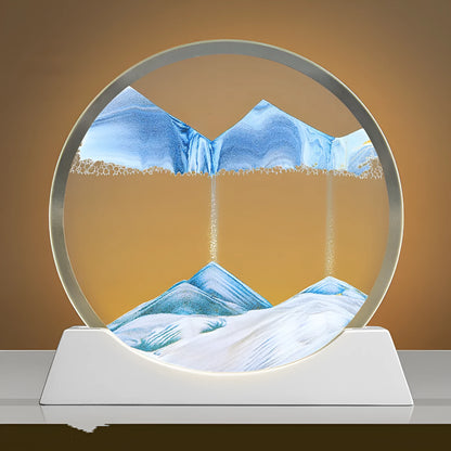 Modern abstract quicksand painting rotary night lamp in blue, 12 inches tall on a desktop.