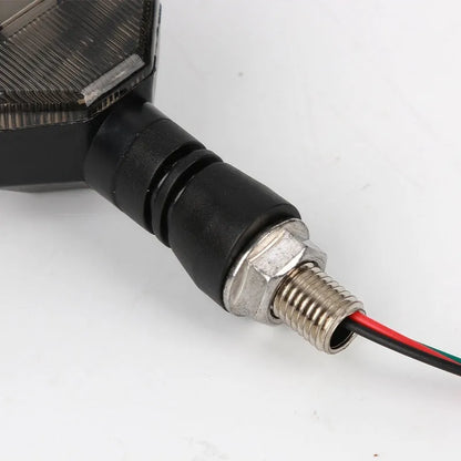 Arrow-shaped LED motorcycle directional turn signal light for 12V systems.