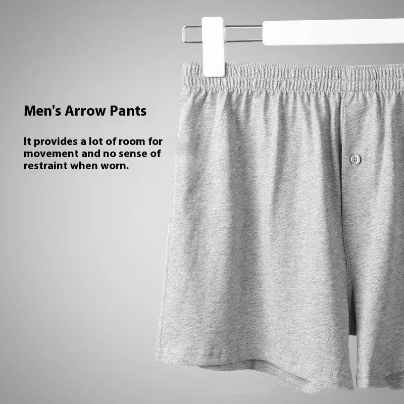 Men's light grey cotton boxer shorts with a loose fit and high waist on a plain background.