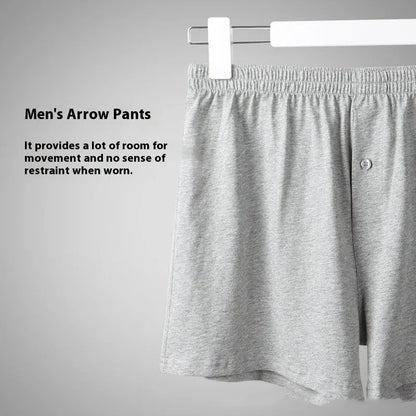 Men's light grey cotton boxer shorts with a loose fit and high waist on a plain background.