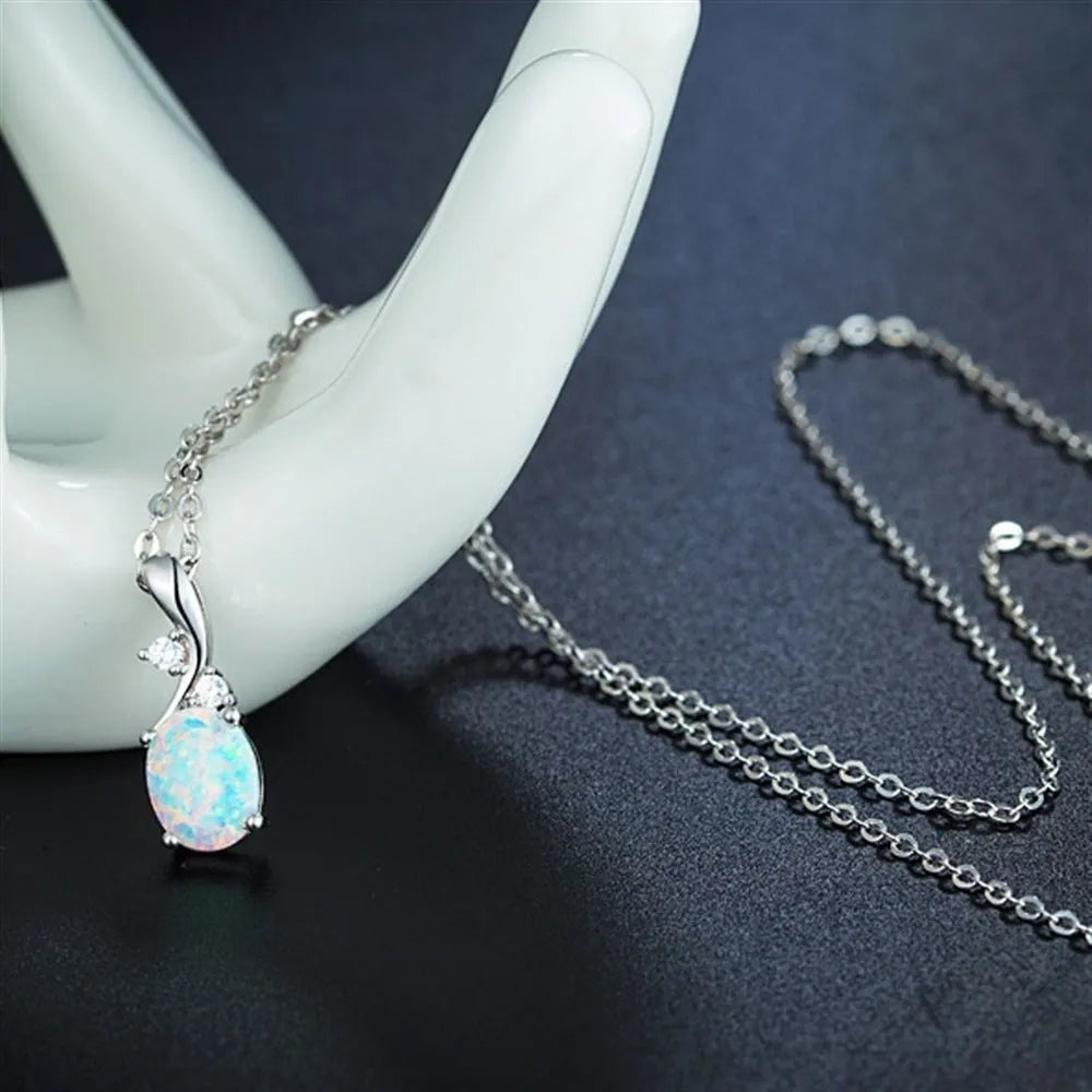 Water drop opal pendant on an adjustable O-shaped alloy necklace in rose gold or white.