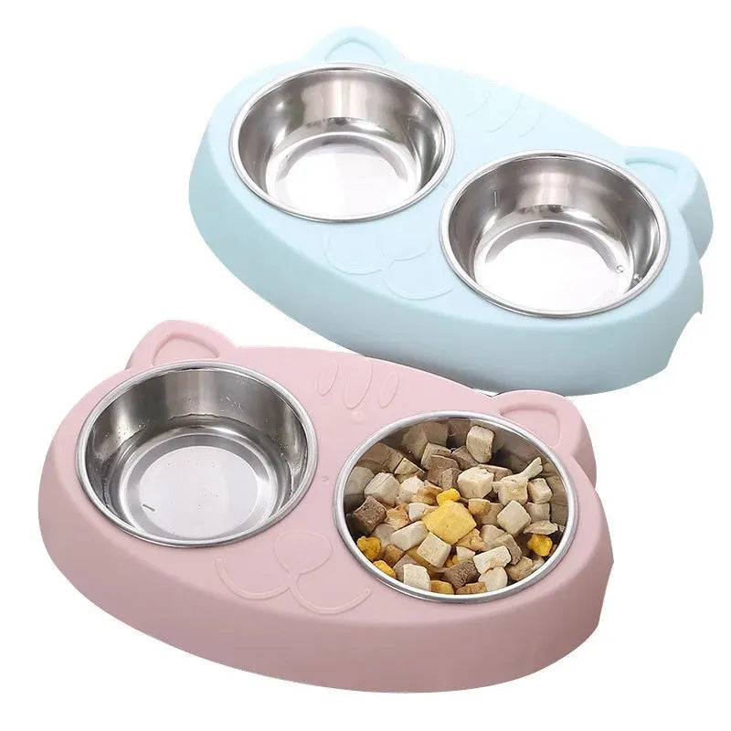 Blue macaron-shaped plastic pet feeder with two food bowls.