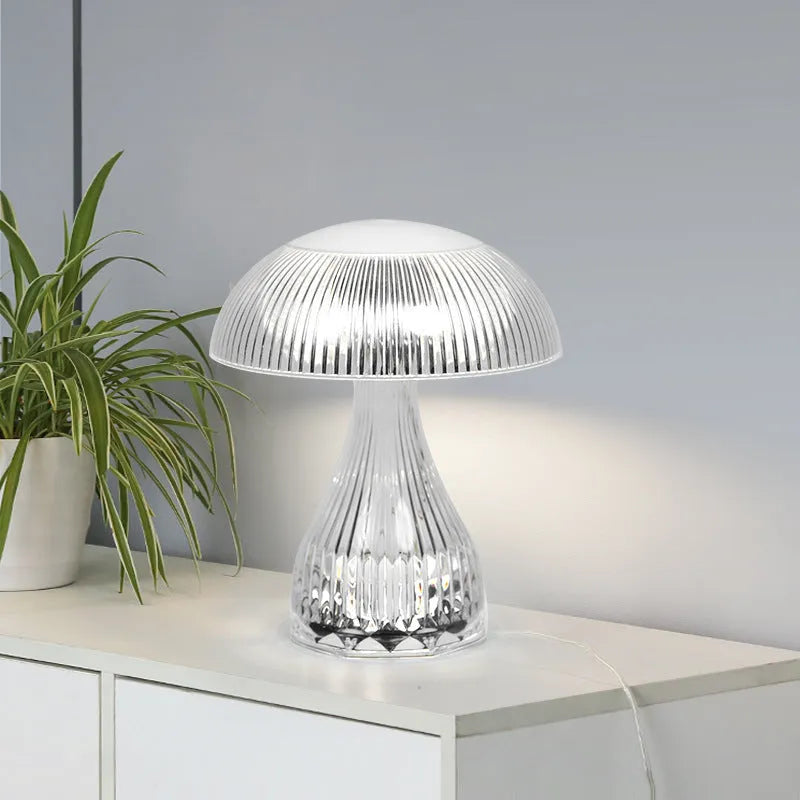 Small white acrylic USB rechargeable table lamp with a three-colour LED light.