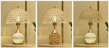 Gold crystal desk lamp with hand-cut facets and remote control on wooden surface