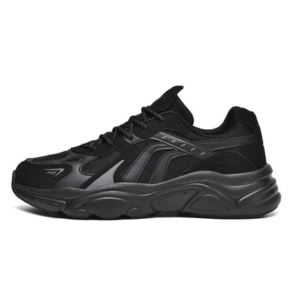 Men's beige and black collapse flat casual sneakers with low heel on a plain background