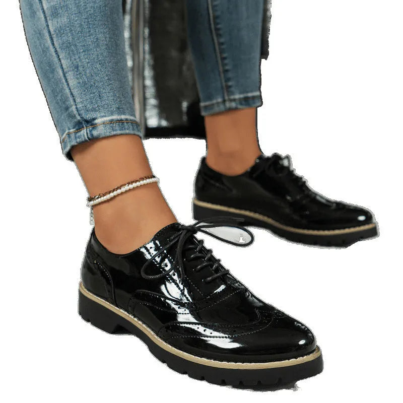 Women's black sequin lace-up loafers with a wedge heel and round toe