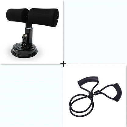 Compact sit-up strength trainer with steel springs and foam padding for home fitness