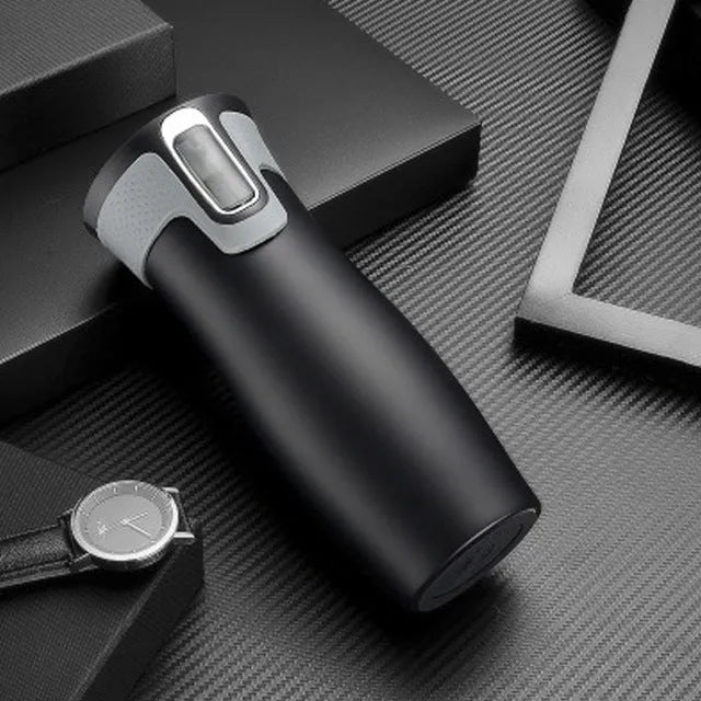 Black vacuum insulated stainless steel travel flask with push-button lid, 450ml capacity.