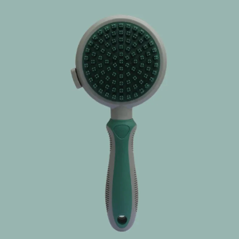 Green and pink dual-sided pet brush showing slicker pins and silicone massage nubs on a wooden table.