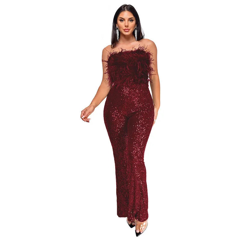 Women's sleeveless backless jumpsuit with flared legs in a wine red colour.