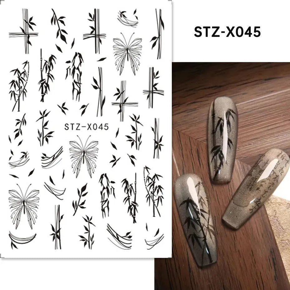 Assortment of black and silver nail sticker designs including cartoon and French tip patterns on a plastic sheet.