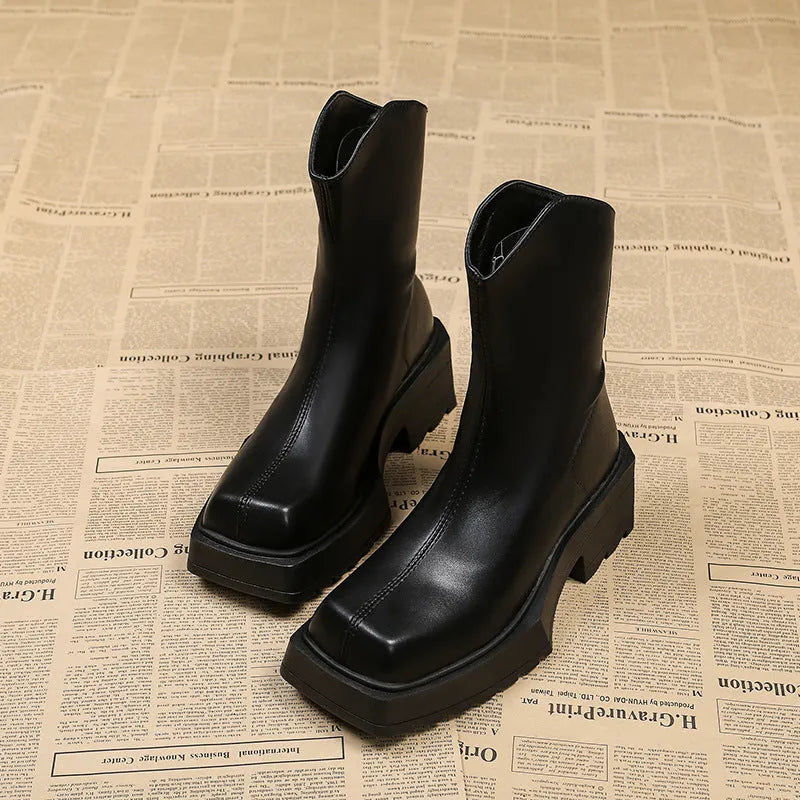 Black platform Martin boots for women with square toe, back zipper, and rubber sole.