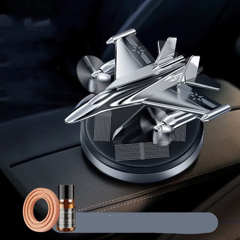 Solar-powered rotating perfume ornament in fighter jet design with aluminium alloy seat and essential oil bottle