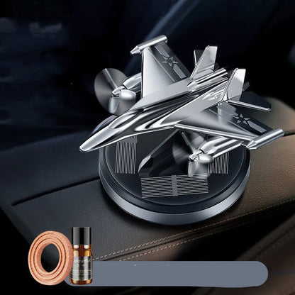 Solar-powered rotating perfume ornament in fighter jet design with aluminium alloy seat and essential oil bottle