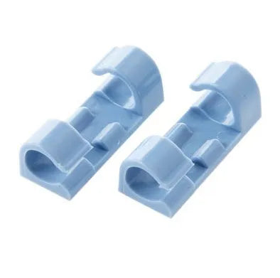 Self-adhesive plastic cable organiser clips in various colours holding a bundle of wires against a wall.