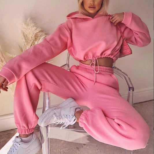 Stylish 2-piece athleisure sets for women in a variety of vibrant colors, including pink, purple, black, blue, and more.