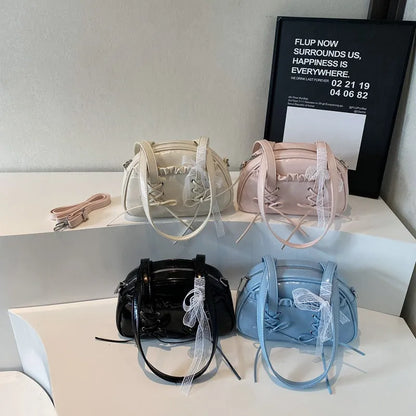 Women's PU leather casual shoulder handbag with a large bandage bow and sewing thread detail.