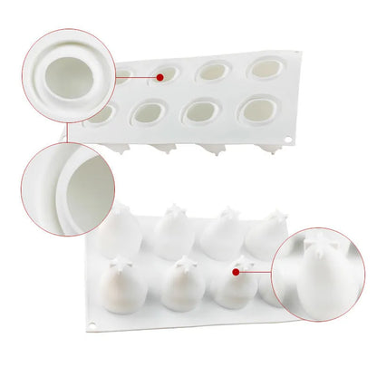 Flexible blue silicone baking mould with six cavities shaped like pineapples and pine cones on a kitchen counter.