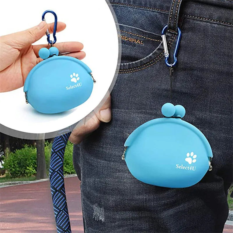 Yellow silicone dog training treat pouch with hook and loop closure, shown on a waistband.