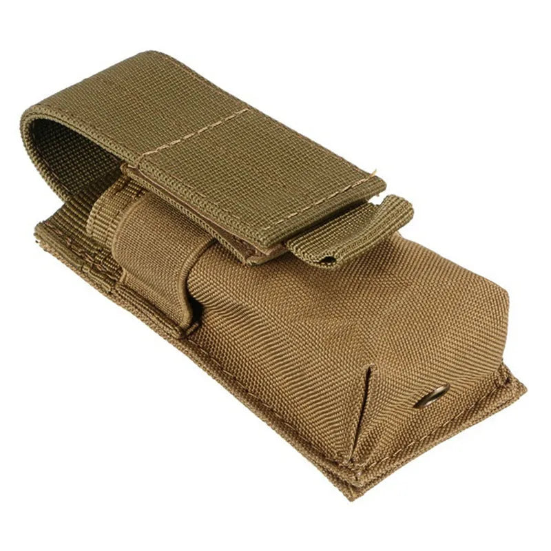 Black tactical MOLLE waist pouch with elastic cord closure, shown mounted on a belt next to a pistol magazine.