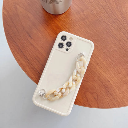 Marble pattern silicone phone case for iPhone with attached TPU bracelet, shown in grey blue colour.