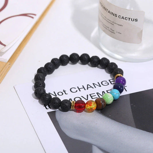 Handcrafted beaded bracelet with seven chakra-representing beads, designed to promote balance and well-being.
