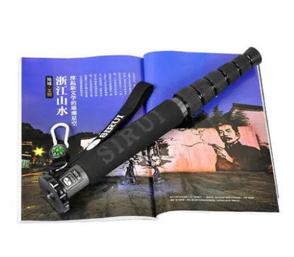 Black carbon fibre telescopic monopod for SLR cameras shown at full extension.