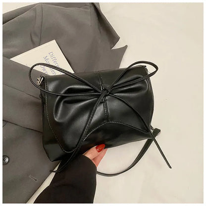 Black horizontal square PU crossbody bag showing internal mobile phone pocket and crossbody strap