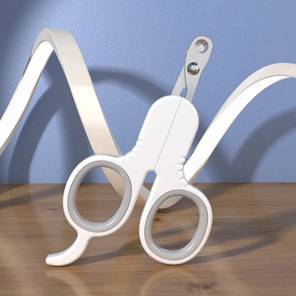 Grey and pink pet nail clippers with curved tips and a rubber-coated ergonomic handle on a table.
