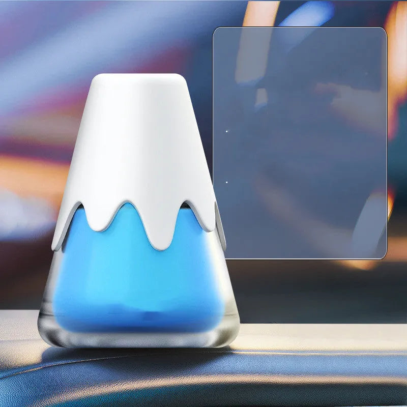 Snow Mountain car air freshener, a compact glass unit with fragrance paste, shown in purple colour.