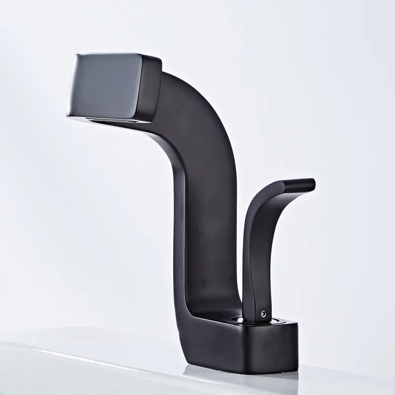 Copper vanity basin mixer tap with lift handle, shown in black and gold finish.