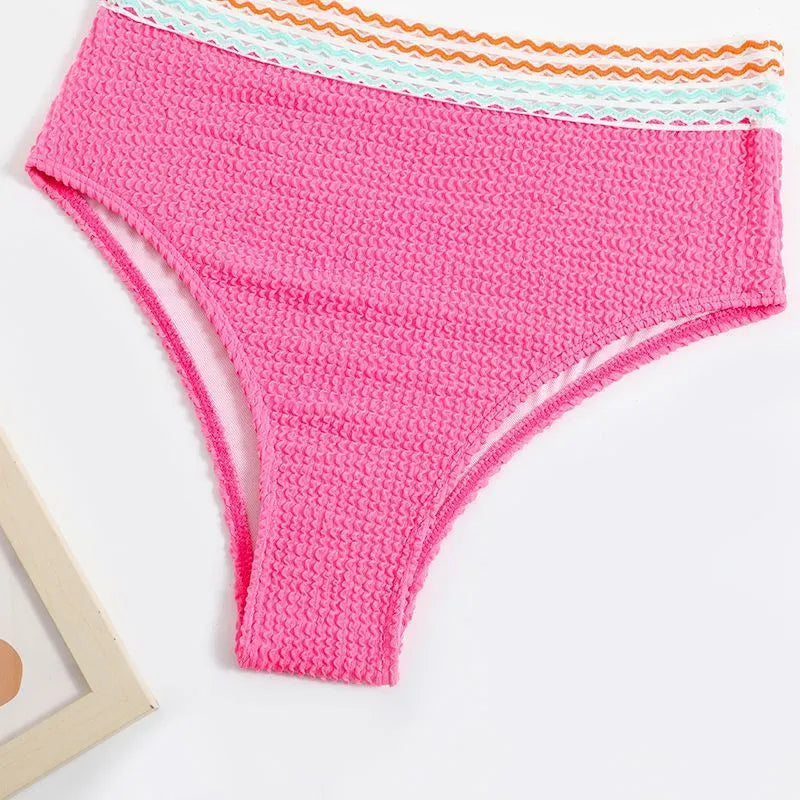 Women's high waist bikini set in solid pink colour, showing sleeveless top and briefs.