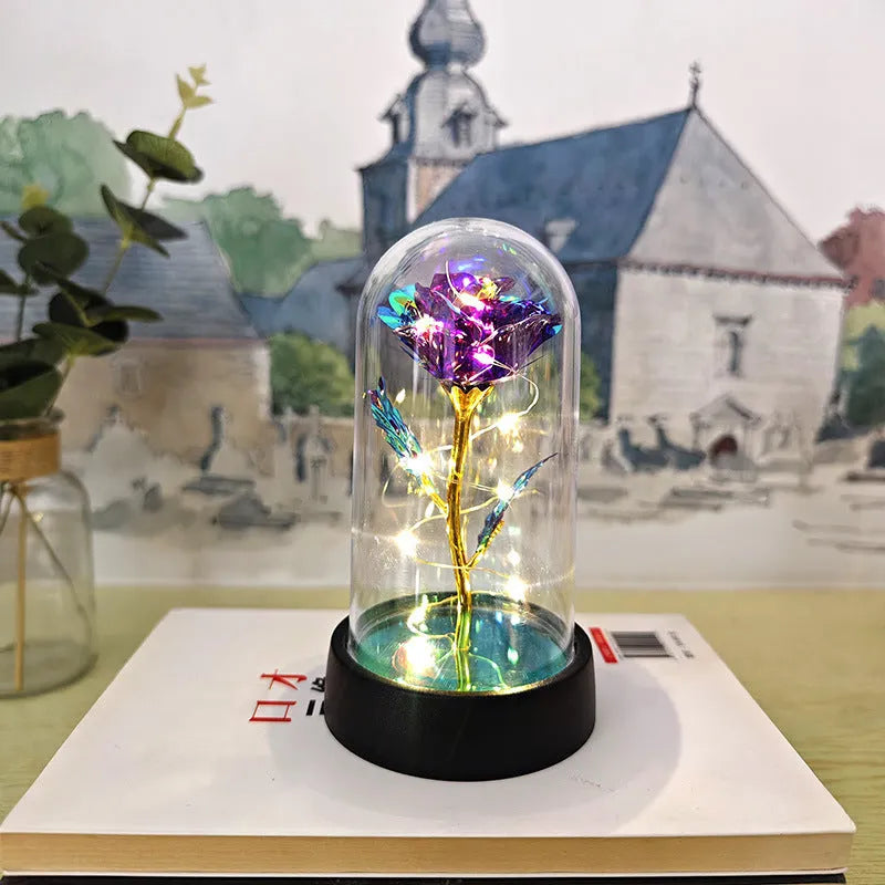 Glass cover small night lamp with plastic flowers, 15cm height, black base, showing colour light options